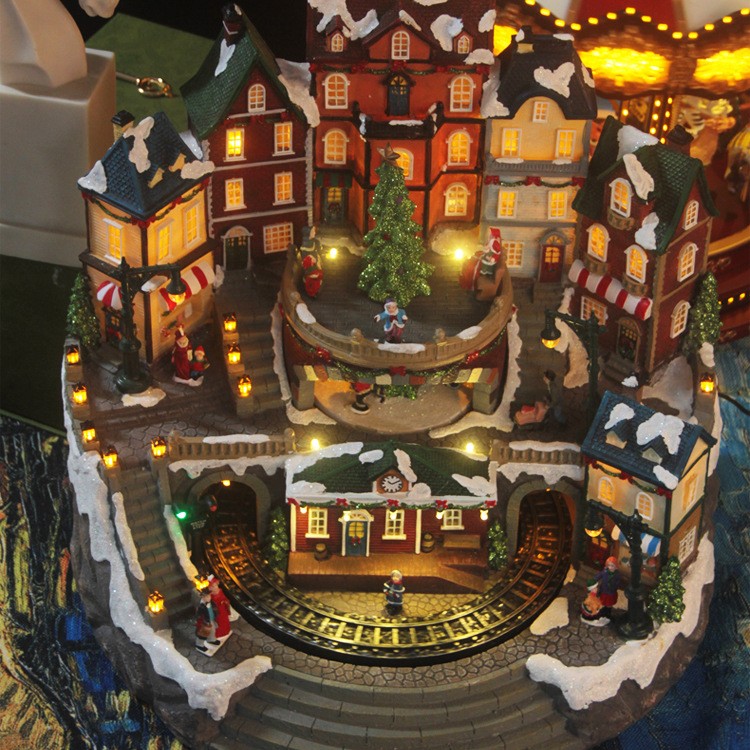 Gran casa musical LED luminosa con tren giratorio y adornos navideños giratorios.