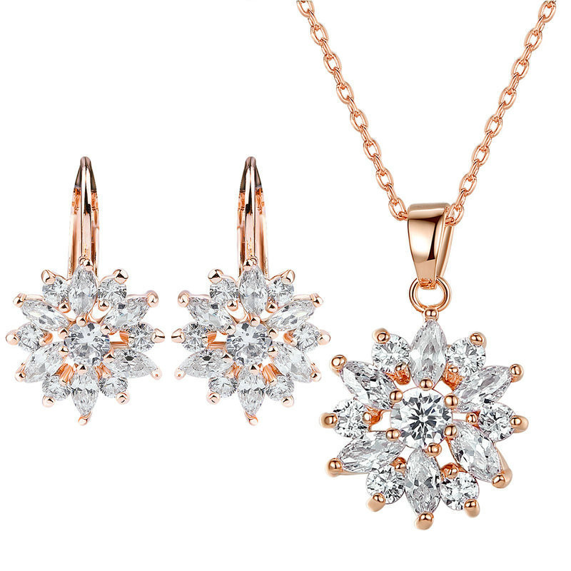 Pendientes de flores de oro champán y circonitas