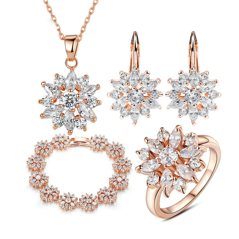 Pendientes de flores de oro champán y circonitas