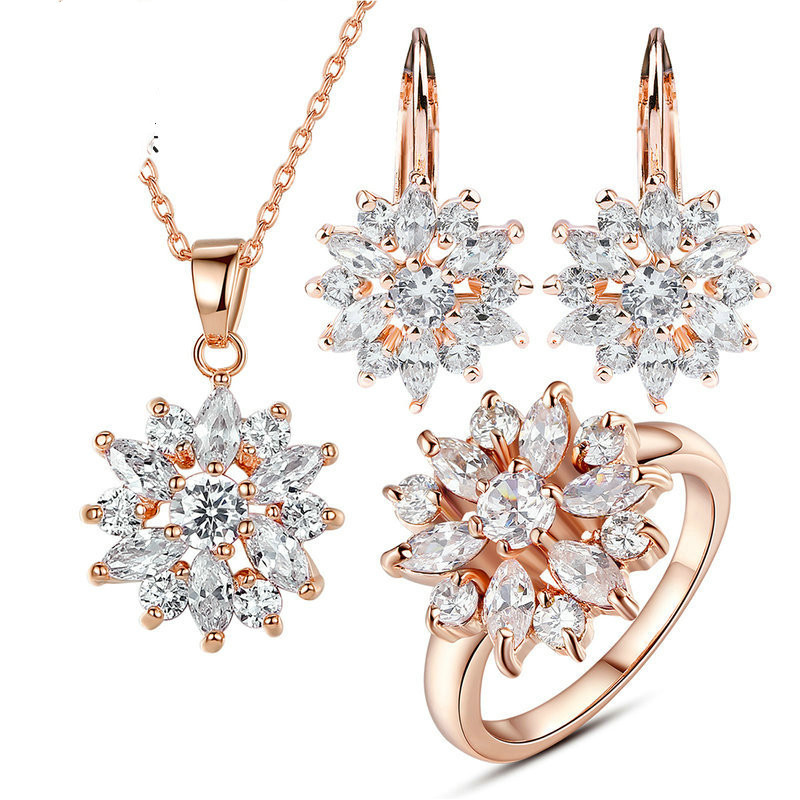 Pendientes de flores de oro champán y circonitas