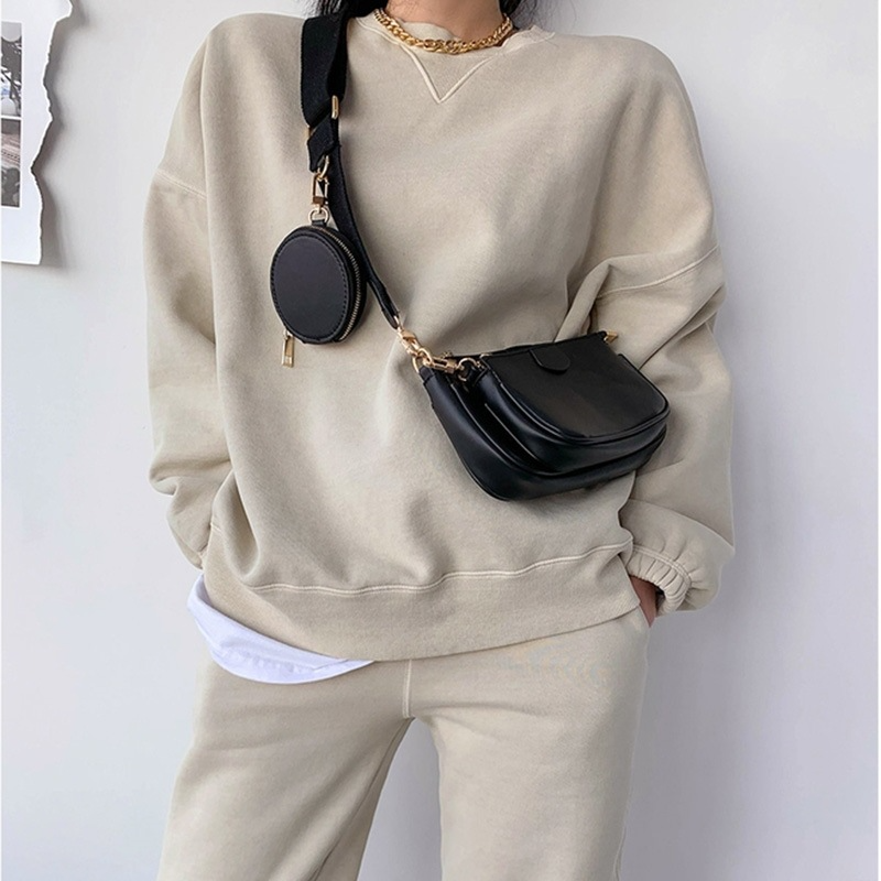 Conjunto de bolsos de mano negros de lujo para mujer.