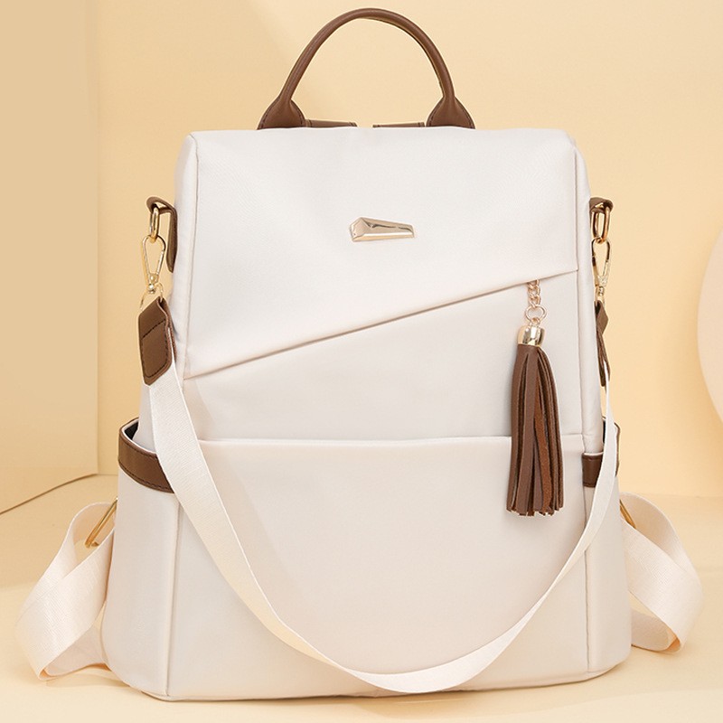 Nueva mochila de moda con borlas para mujer, informal y sencilla.