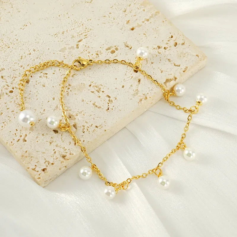 Tobillera de acero inoxidable con borlas y perlas de moda