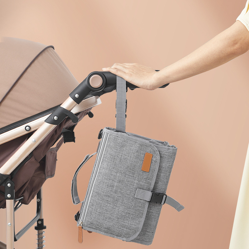 Cambiador de orina impermeable y práctico con almacenamiento multifunción