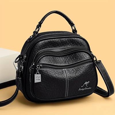 OGEHUAFEE Women’s Elegant Mini Backpack – Premium PU Crossbody/Backpack Hybrid with Kangaroo Logo & Tassel Accents