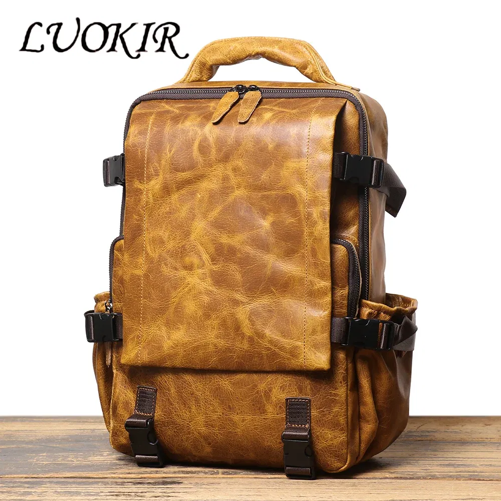 Color: Brown - LUOKIR New Men's Genuine Leather Travel Backpack Women's Cowhide School Bag Large Capacity Backpack Original Double Shoulder Bag