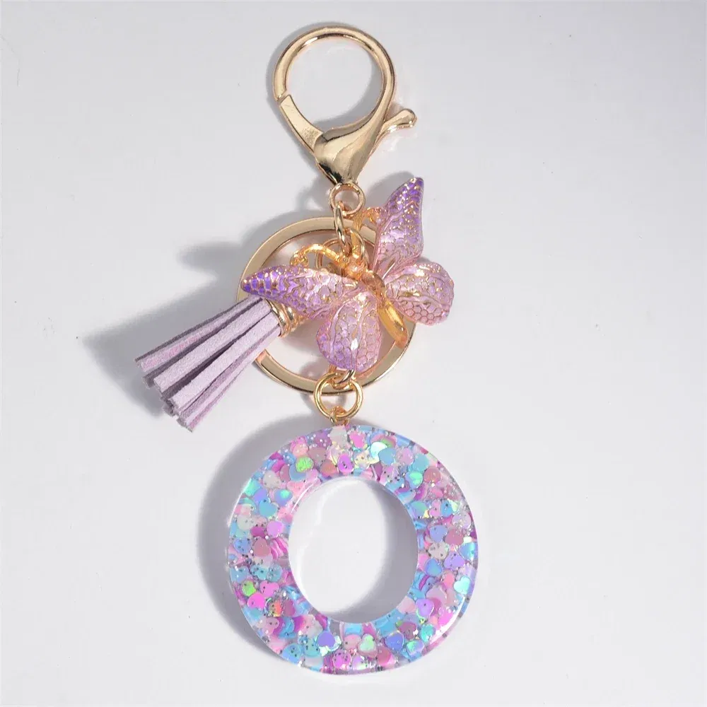 Color: Light Blue - Fashion Tassel Butterfly 26Letter Keychain Colorful Love Heart Filled Resin Alphabet Keyring Women Girls Car Bag Phone Pendant