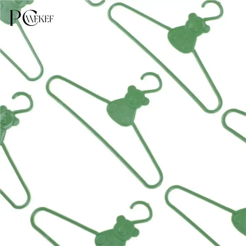 Color: Black - 10/20 PCS / Lot Lovely Green Hangers Mini Cute Wardrobe Dress Coat Clothes Plastic Accessories For Babi Doll Dollhouse Gift Toy
