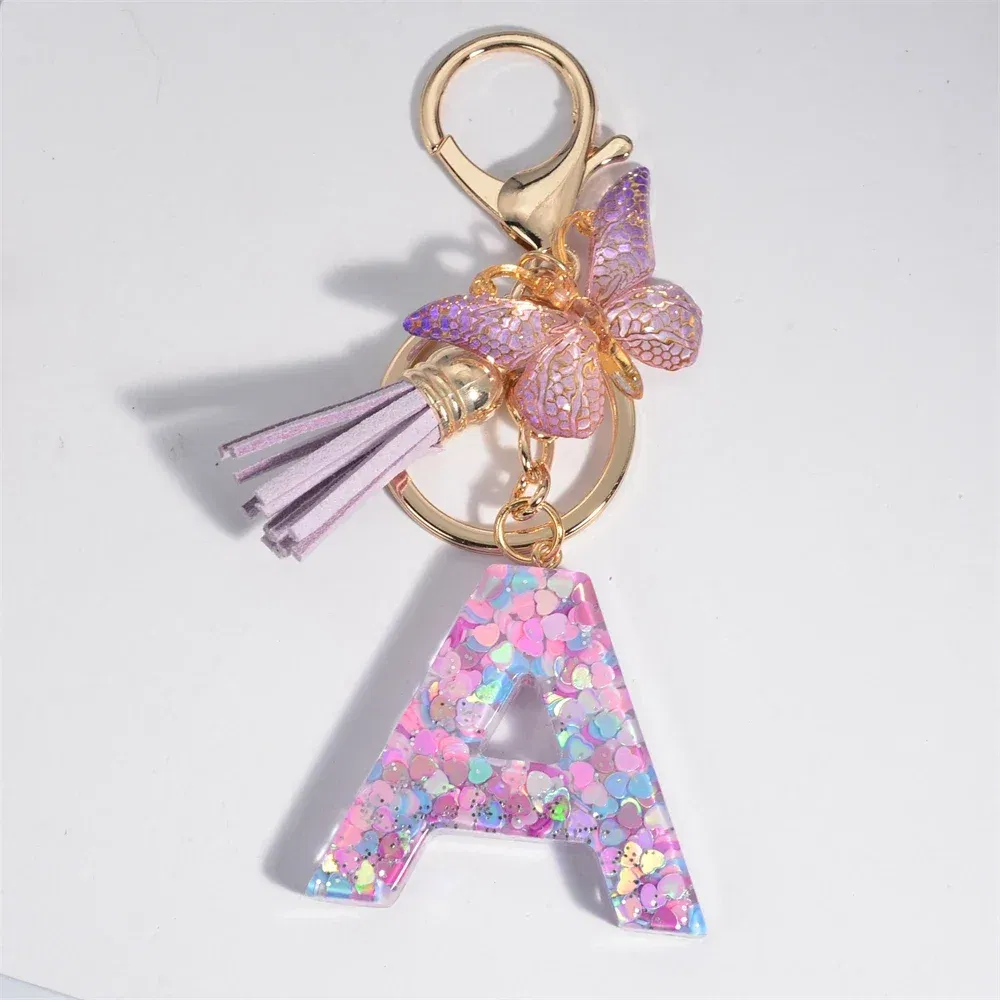 Color: WHITE - Fashion Tassel Butterfly 26Letter Keychain Colorful Love Heart Filled Resin Alphabet Keyring Women Girls Car Bag Phone Pendant