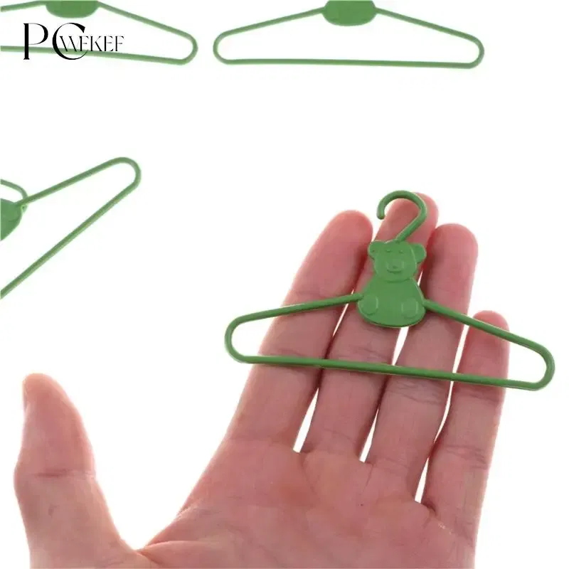 Color: Yellow - 10/20 PCS / Lot Lovely Green Hangers Mini Cute Wardrobe Dress Coat Clothes Plastic Accessories For Babi Doll Dollhouse Gift Toy