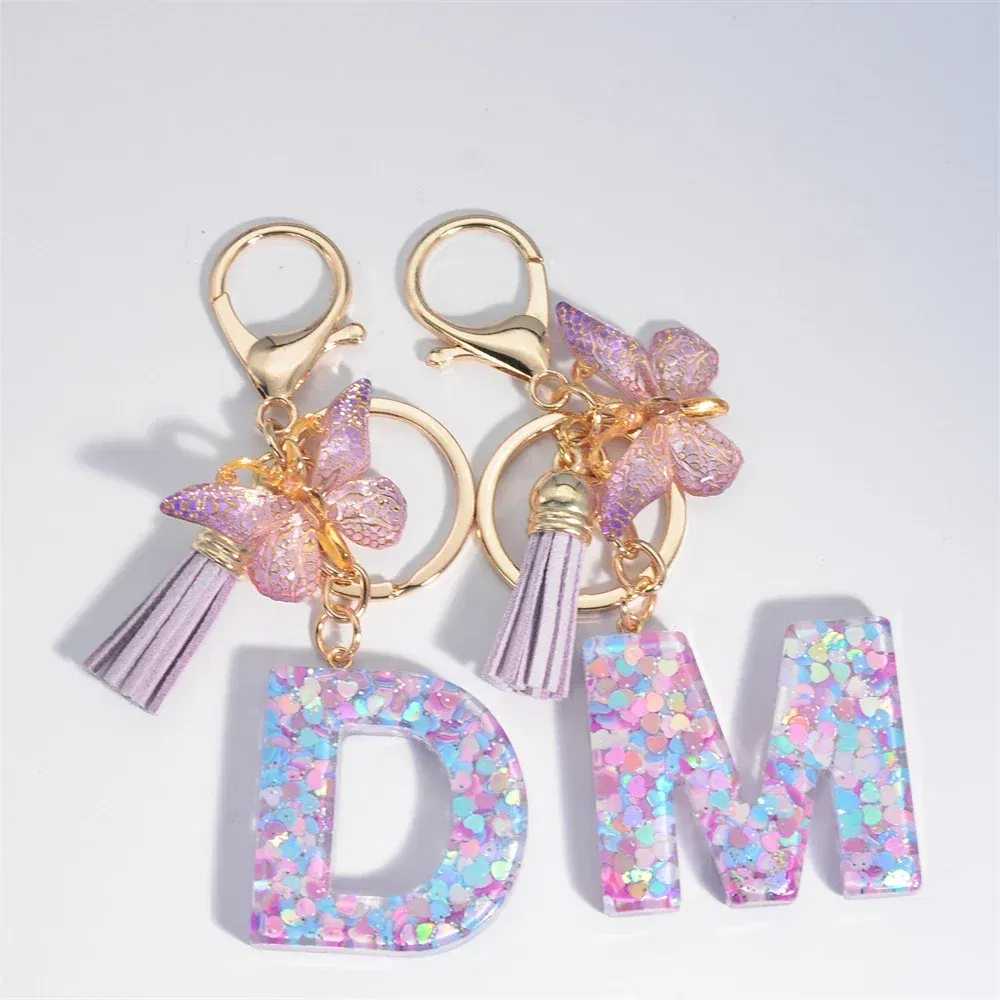 Color: Red - Fashion Tassel Butterfly 26Letter Keychain Colorful Love Heart Filled Resin Alphabet Keyring Women Girls Car Bag Phone Pendant