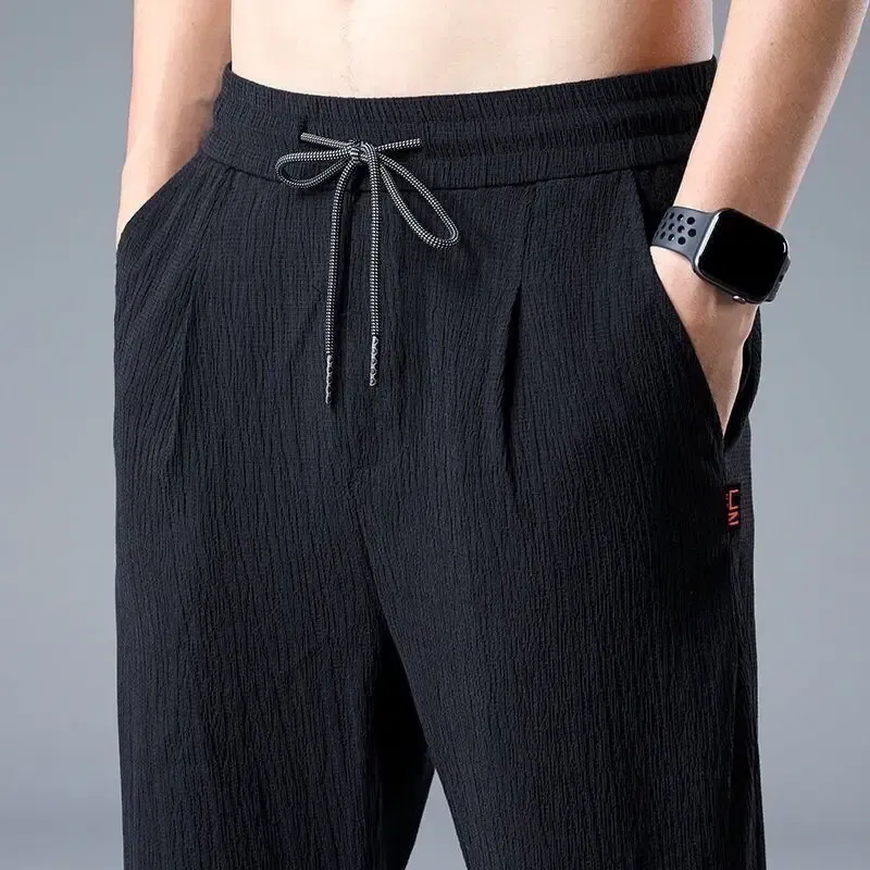 Color: black, Size: 5XL - Summer Ice Silk Man Jogger Linen Pants Casual Wide Summer Sweatpants Male Spring Lightweight Halking Harem Trousers
