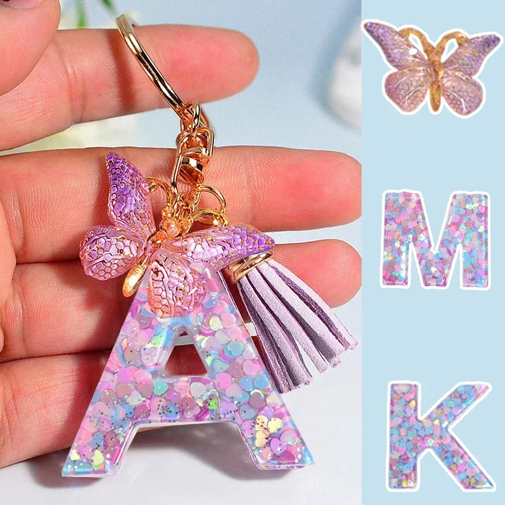 Color: PURPLE - Fashion Tassel Butterfly 26Letter Keychain Colorful Love Heart Filled Resin Alphabet Keyring Women Girls Car Bag Phone Pendant