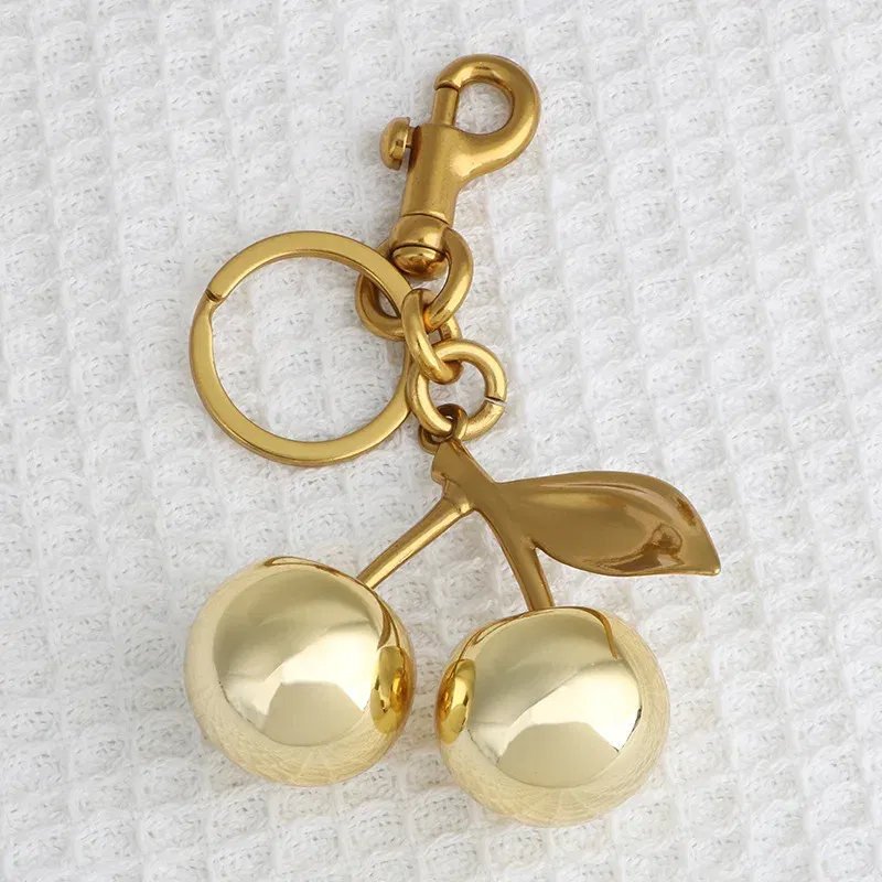 Color: Bronze - Fashion Glitter Gold Cherry Keychain Summer Fruits Cherries Pendant Keyring For Women Men Jewelry Bag Accessories Gift