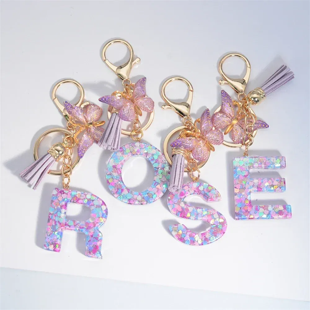Color: Pink - Fashion Tassel Butterfly 26Letter Keychain Colorful Love Heart Filled Resin Alphabet Keyring Women Girls Car Bag Phone Pendant