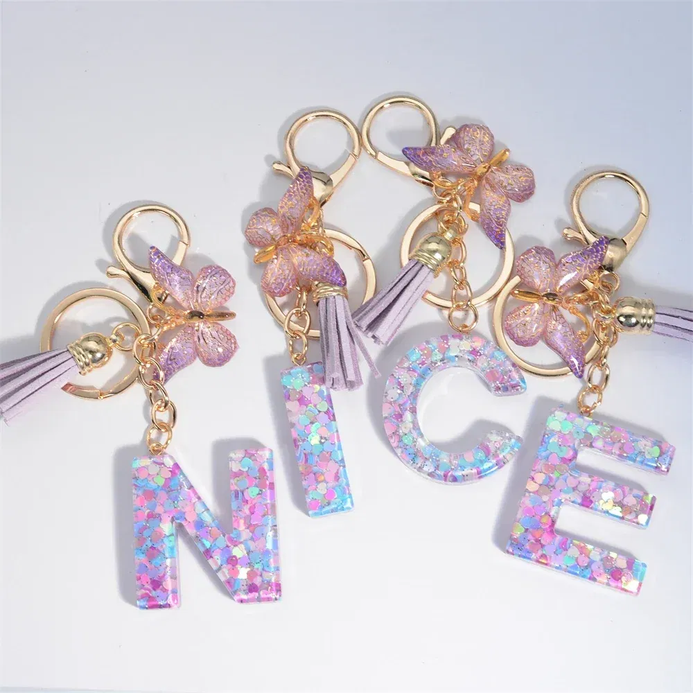 Color: Ivory - Fashion Tassel Butterfly 26Letter Keychain Colorful Love Heart Filled Resin Alphabet Keyring Women Girls Car Bag Phone Pendant