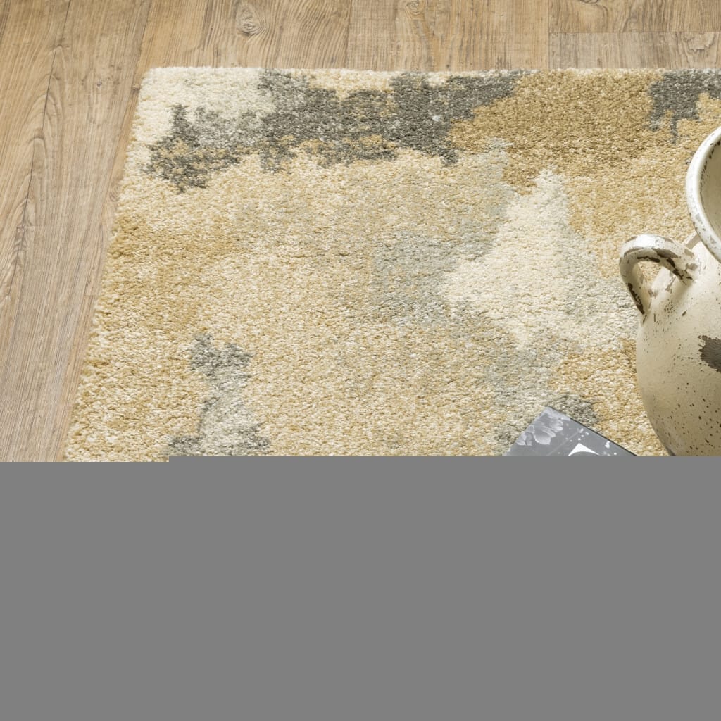 6' X 9' Beige Grey And Gold Abstract Power Loom Stain Resistant Area Rug
