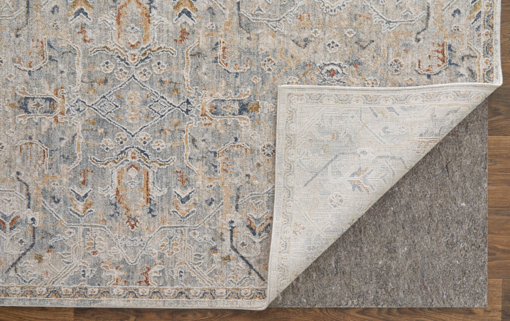 7' X 10' Ivory Tan and Blue Abstract Power Loom Worn Faded Area Rug With Fringe
