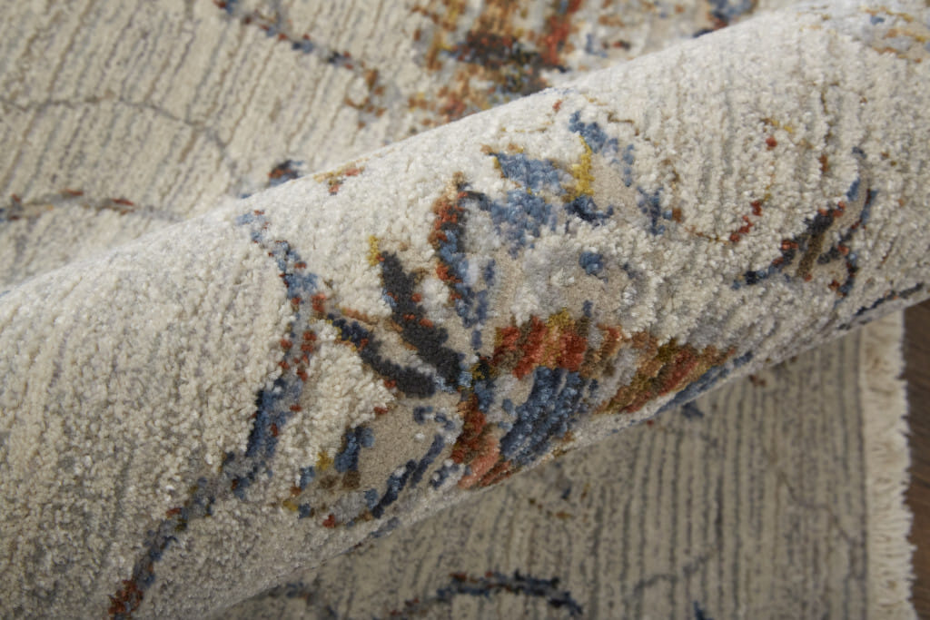 8' X 10' Ivory and Blue Floral Power Loom Distressed Non Skid Area Rug With Fringe
