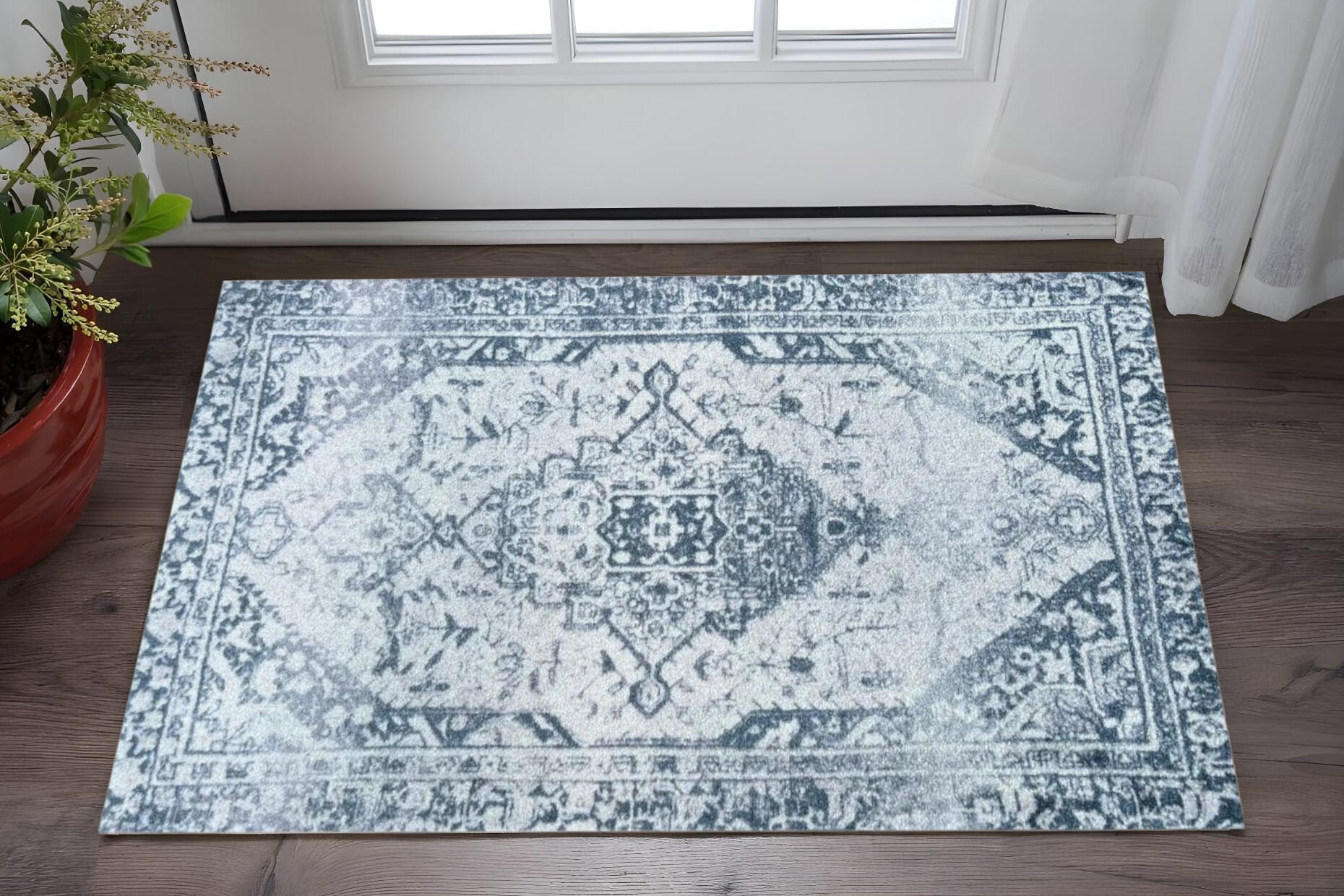 2' X 3' Dark Blue Gray and Ivory Oriental Distressed Washable Non Skid Area Rug With UV Protection
