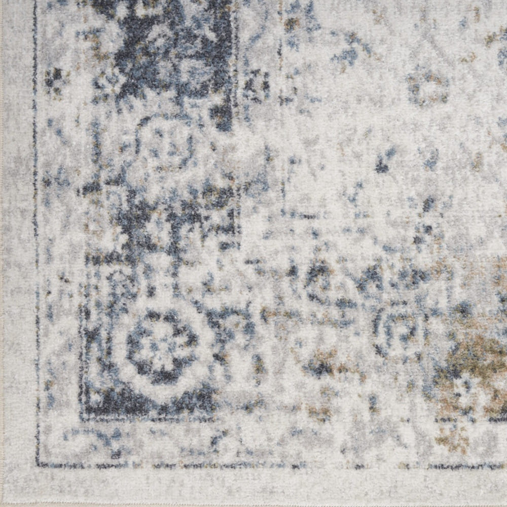 9' X 12' Blue and Ivory Floral Medallion Power Loom Distressed Washable Area Rug