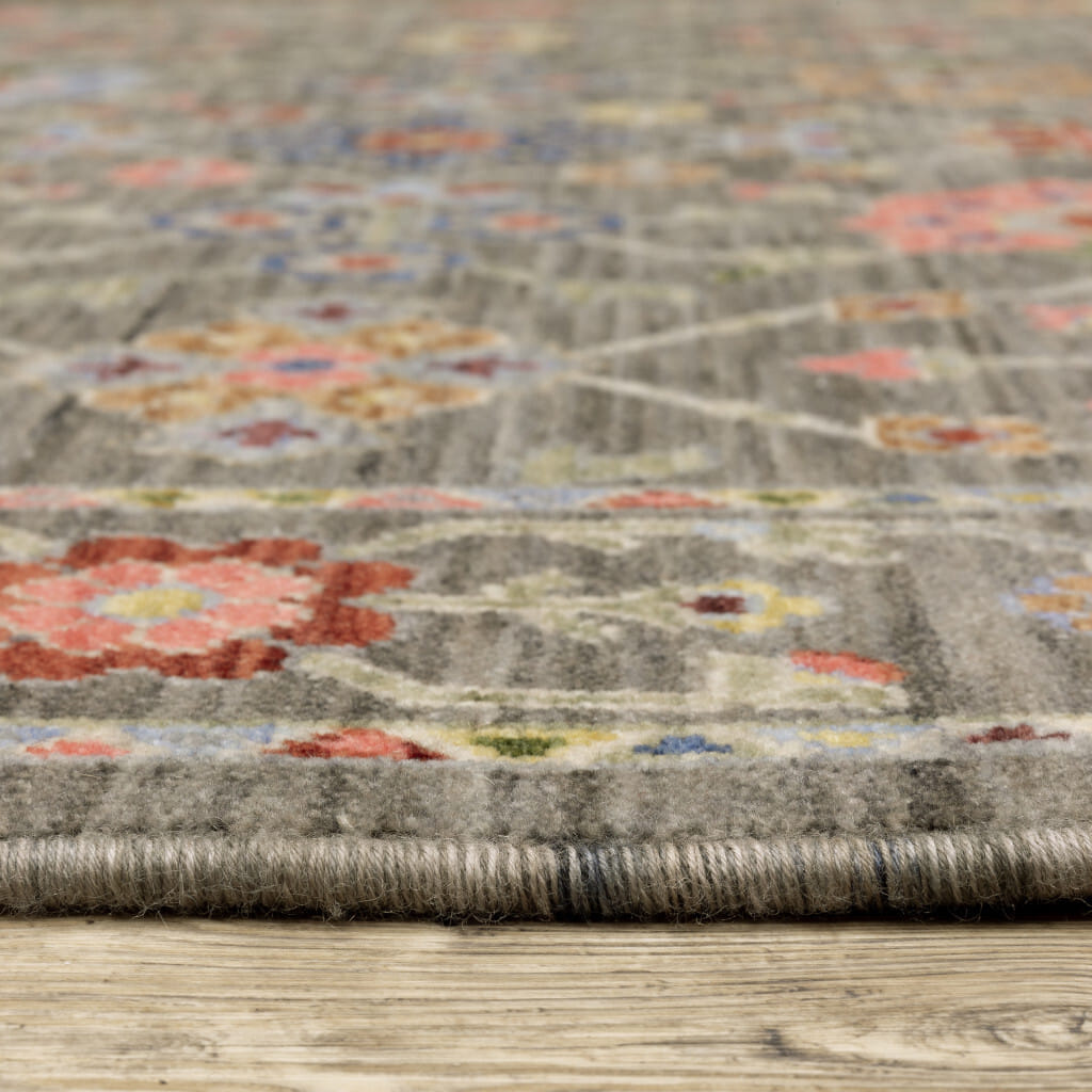 8' X 11' Grey Salmon Pink Gold Blue Rust Deep Blue Ivory And Green Oriental Power Loom Stain Resistant Area Rug With Fringe