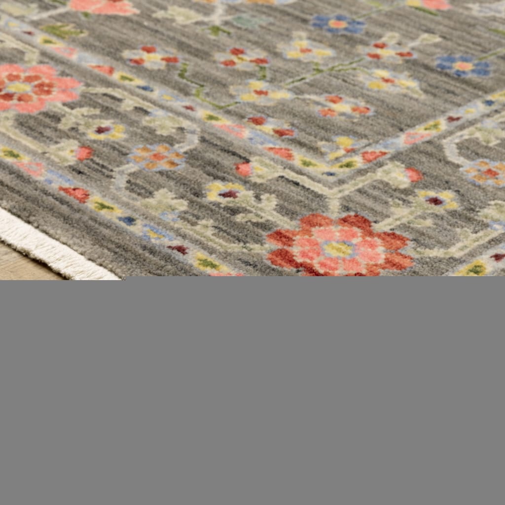 8' X 11' Grey Salmon Pink Gold Blue Rust Deep Blue Ivory And Green Oriental Power Loom Stain Resistant Area Rug With Fringe