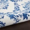5' X 7' Blue And Ivory Floral Dhurrie Area Rug