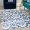 5' X 7' Blue And Ivory Floral Dhurrie Area Rug