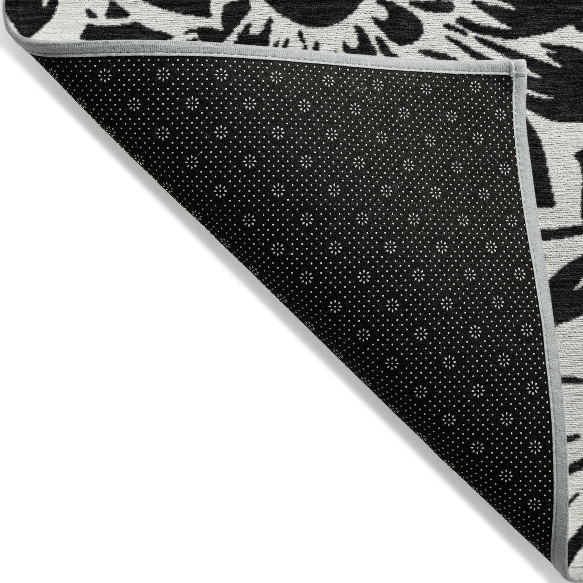 5' X 8' Black and Ivory Floral Washable Non Skid Indoor Outdoor Area Rug