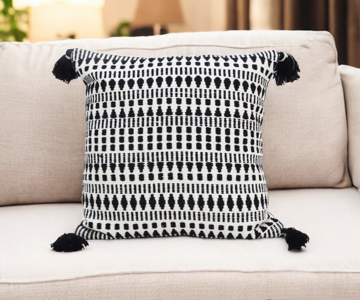 22" Black and White Southwestern Cotton Blend Throw Pillow With Tassels