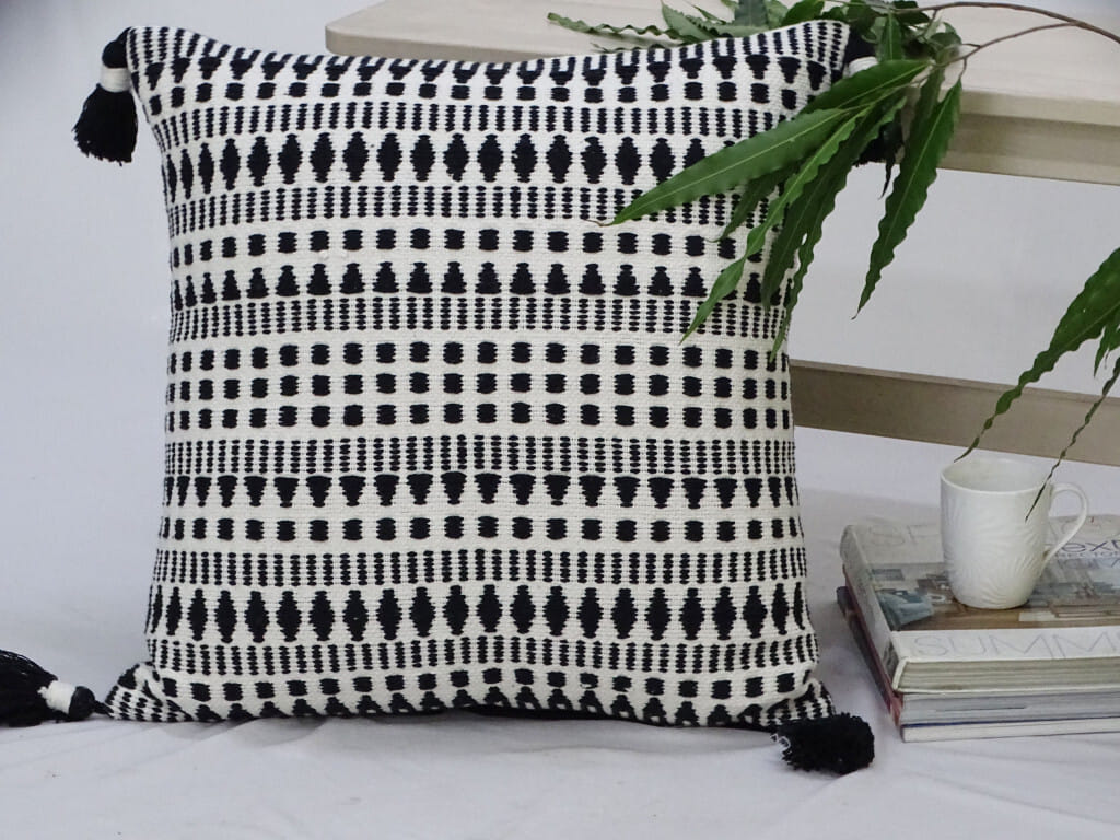 22" Black and White Southwestern Cotton Blend Throw Pillow With Tassels