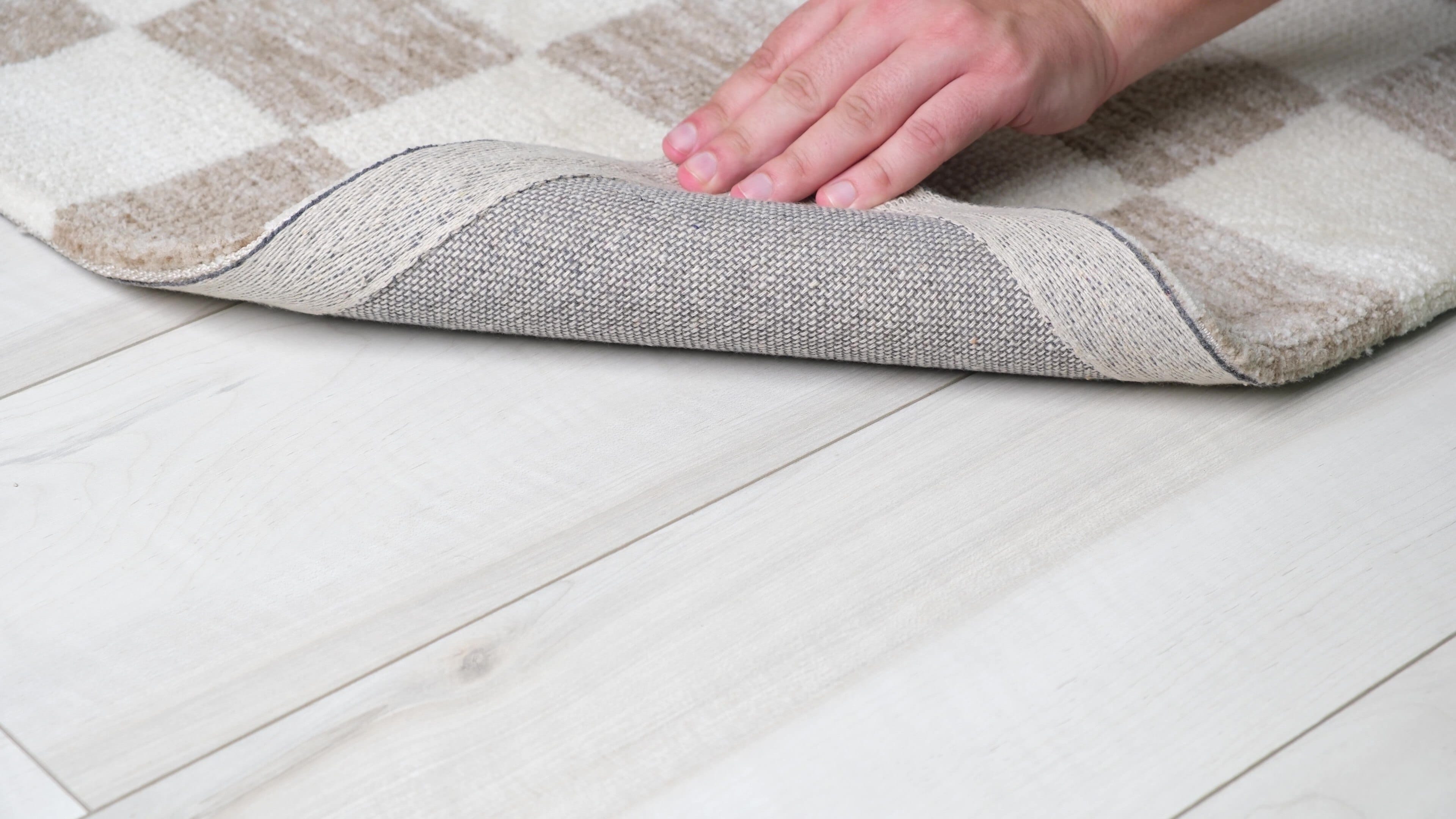 5' X 8' Beige and Brown Checkered Power Loom Area Rug