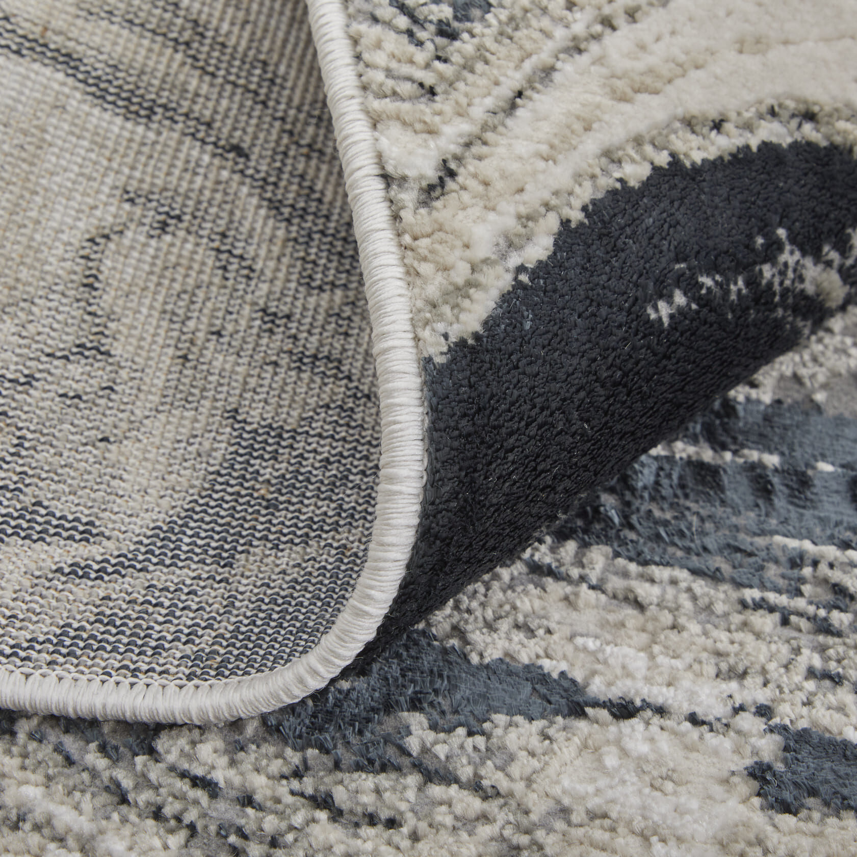 13' X 20' Ivory Black and Taupe Abstract Power Loom Area Rug
