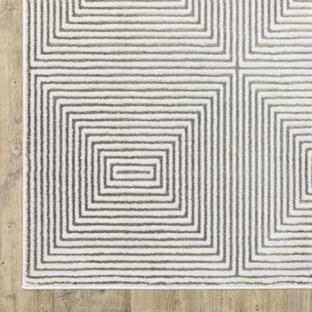7' X 10' Gray and White Geometric Power Loom Area Rug