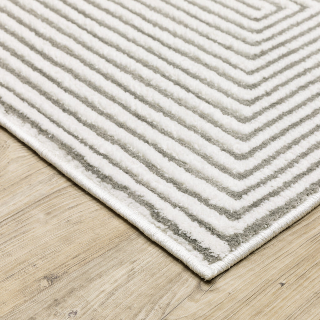 7' X 10' Gray and White Geometric Power Loom Area Rug